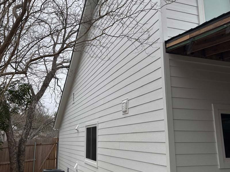 Light horizontal siding with clean trim details
